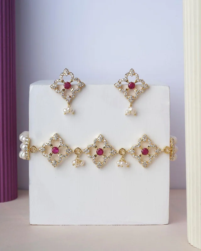 Hoop earrings with multi-tone finishes for a colorful and layered effect-Flory Regal Pearl Choker Set