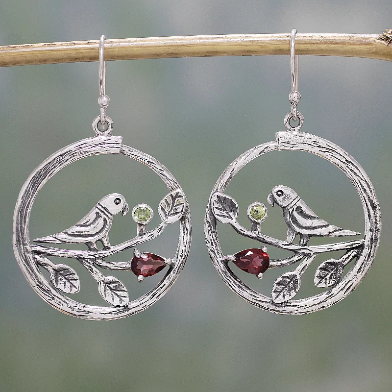 Hoop earrings with rhinestone-studded rims for a glamorous touch-Parrot Song Garnet and Peridot Parrot Dangle Earrings from India